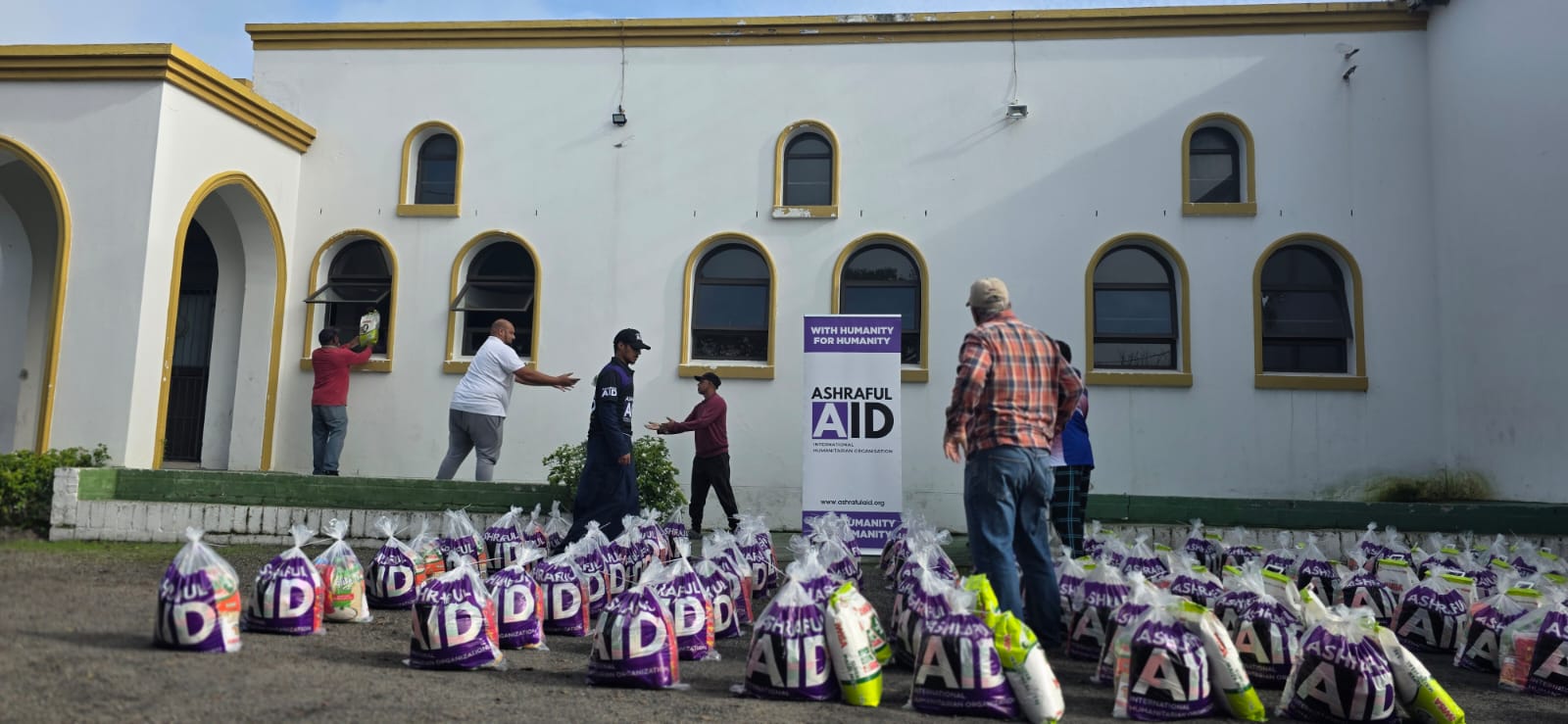Rows of Ashraful Aid hampers ready outside a distribution venue
